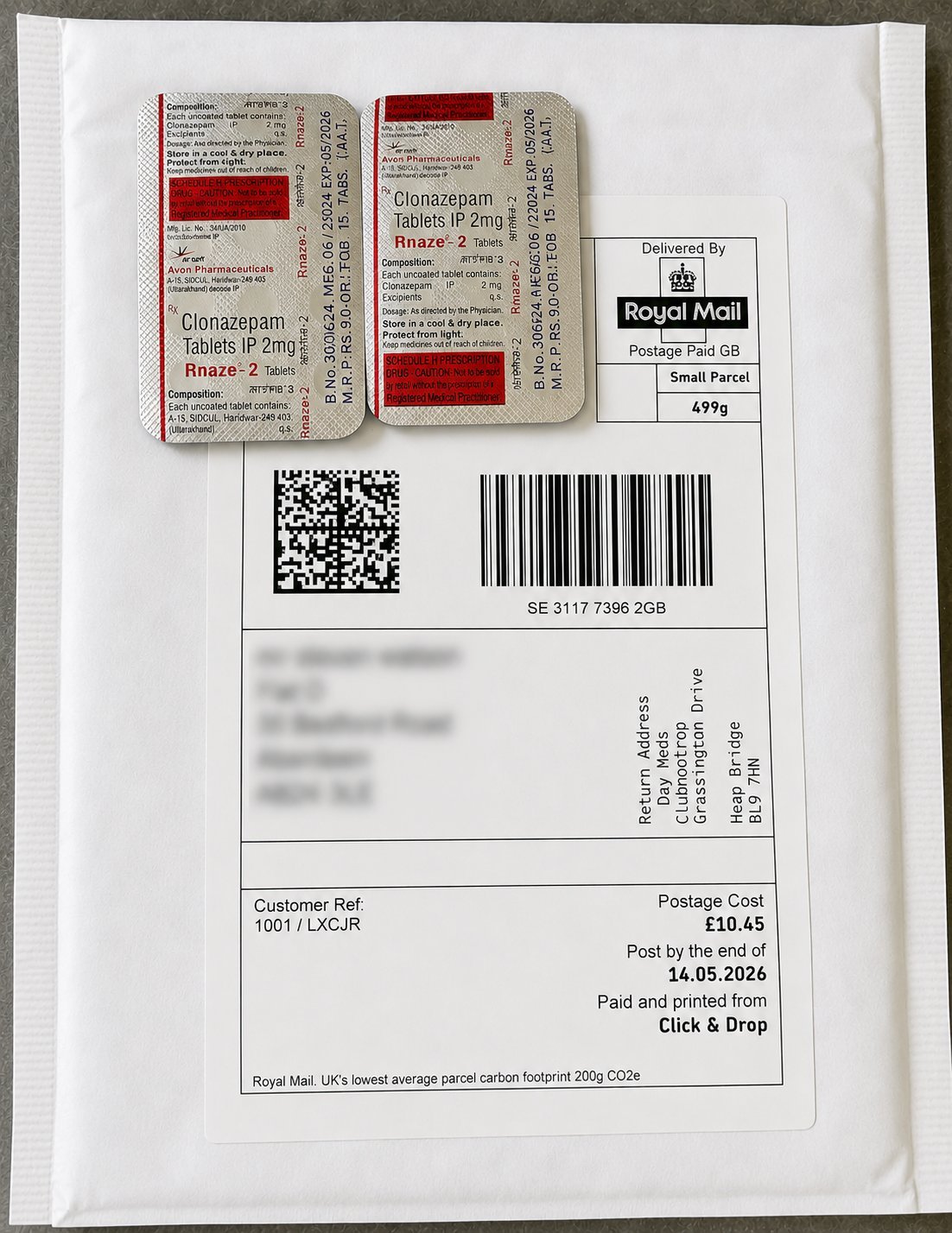 Royal Mail parcel label with two blister packs of Clonazepam tablets 1mg, QR code, and barcode